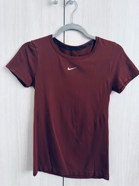 Nike Short Sleeve Performance Top in brown with silver Swoosh